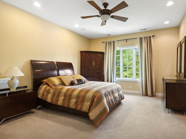 bedroom with ceiling fan, recessed lighting, light carpet, visible vents, and baseboards