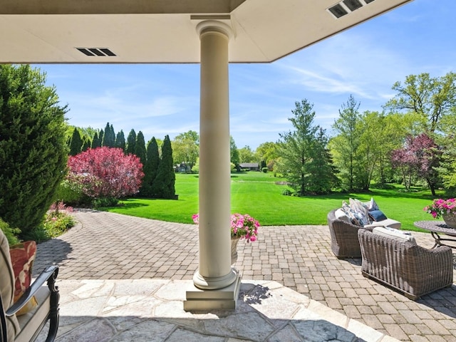 view of patio / terrace featuring visible vents