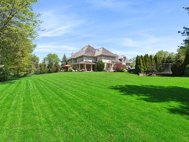 view of yard featuring a trampoline