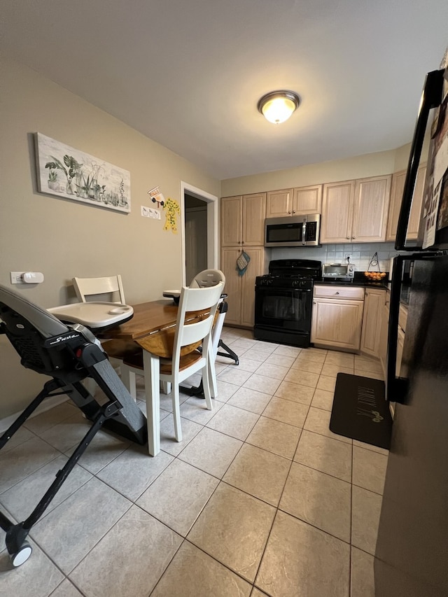 kitchen featuring black appliances, light tile patterned floors, backsplash, and light brown cabinetry