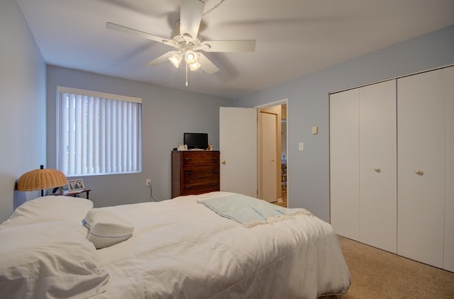 bedroom with ceiling fan and light carpet