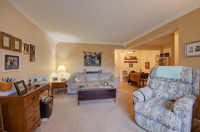 carpeted living room featuring crown molding and ceiling fan