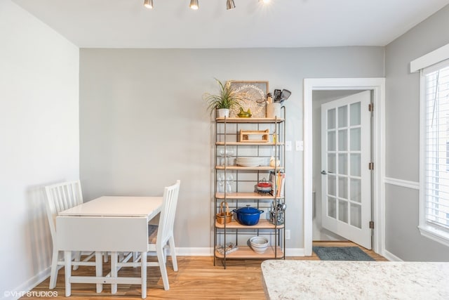 dining space featuring light hardwood / wood-style floors