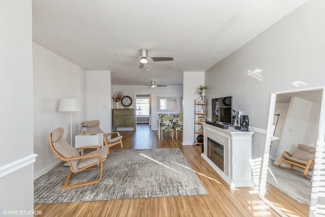 living room with hardwood / wood-style flooring and ceiling fan