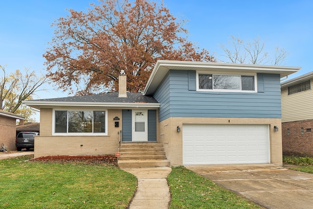 split level home featuring a garage and a front yard