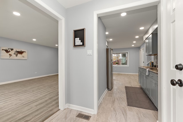 hallway featuring light wood-type flooring