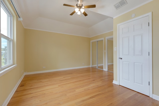 unfurnished bedroom with light wood-type flooring, ceiling fan, and crown molding