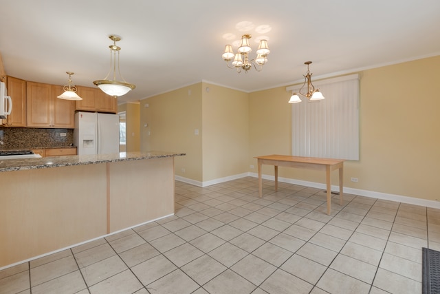 kitchen with light stone countertops, a chandelier, white appliances, decorative backsplash, and ornamental molding