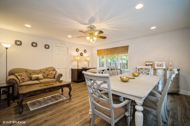 dining area featuring ceiling fan and dark hardwood / wood-style floors