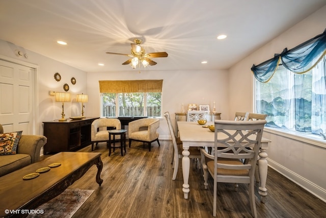 dining space with dark hardwood / wood-style floors and ceiling fan