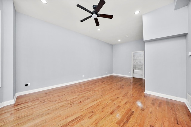 unfurnished living room featuring ceiling fan and light hardwood / wood-style floors