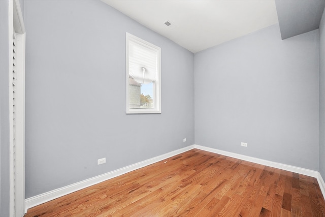 empty room featuring hardwood / wood-style floors