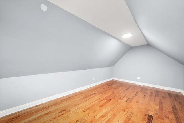 bonus room featuring light hardwood / wood-style floors and lofted ceiling