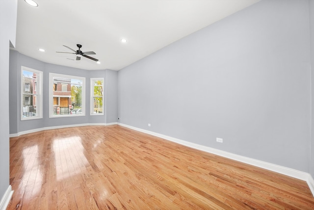 unfurnished room with ceiling fan and light hardwood / wood-style flooring