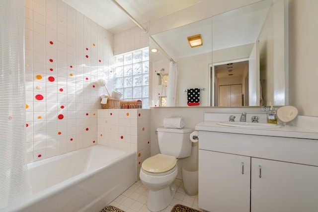 full bathroom with shower / tub combo, vanity, tile walls, tile patterned flooring, and toilet