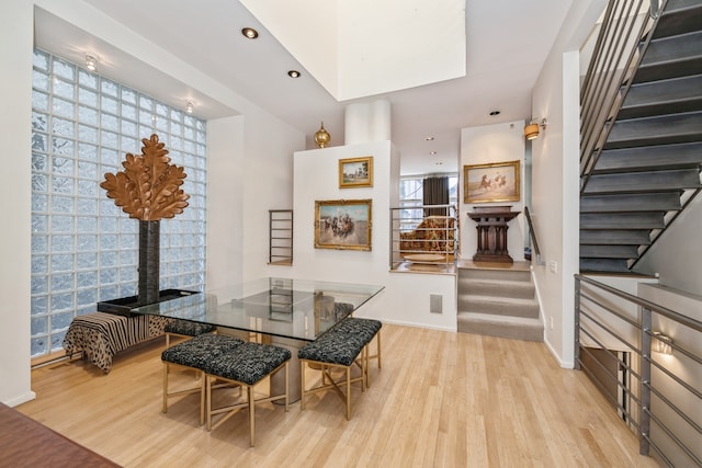 dining space with light hardwood / wood-style floors