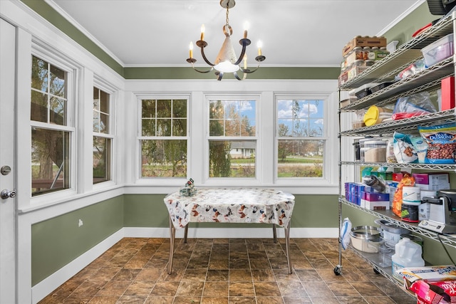 sunroom featuring a chandelier