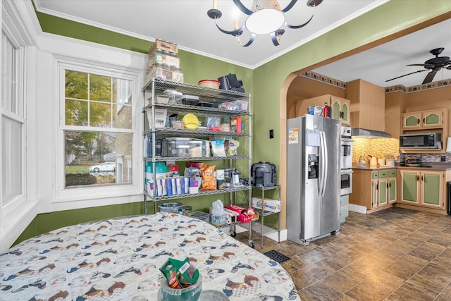 bedroom with stainless steel refrigerator with ice dispenser, an inviting chandelier, and crown molding