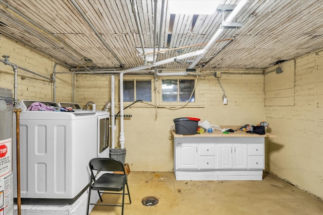 laundry room featuring gas water heater and washer / clothes dryer