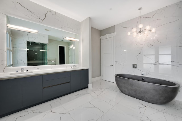 bathroom with a notable chandelier, independent shower and bath, and vanity