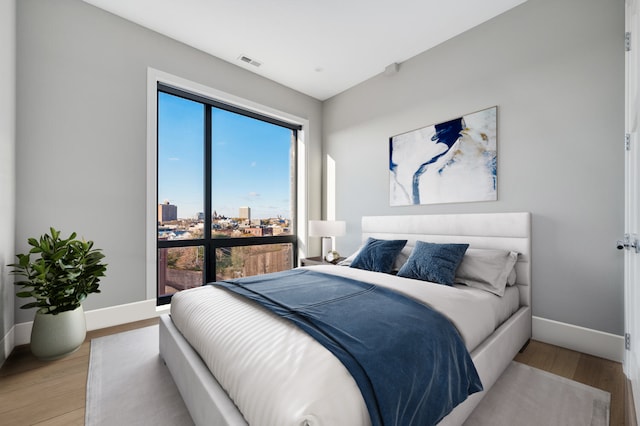 bedroom featuring light wood-type flooring