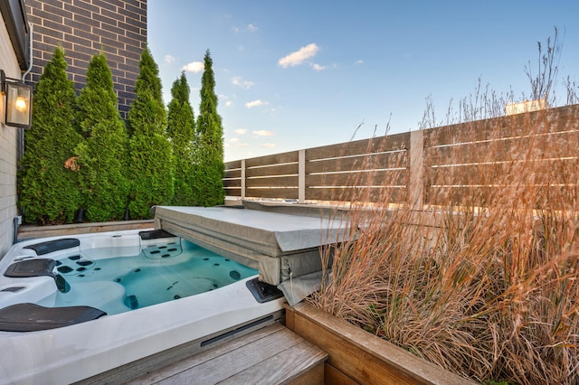 view of pool with a covered hot tub