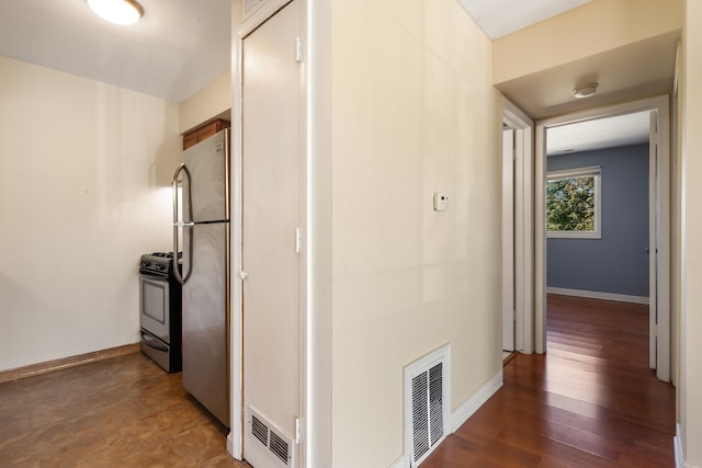 hallway with dark hardwood / wood-style floors