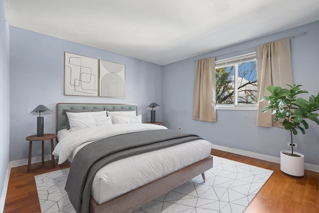 bedroom with hardwood / wood-style flooring