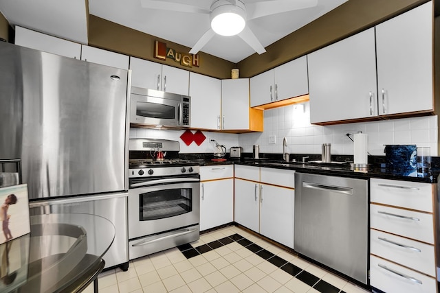 kitchen featuring white cabinets, backsplash, sink, and stainless steel appliances