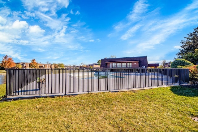 view of pool featuring a yard