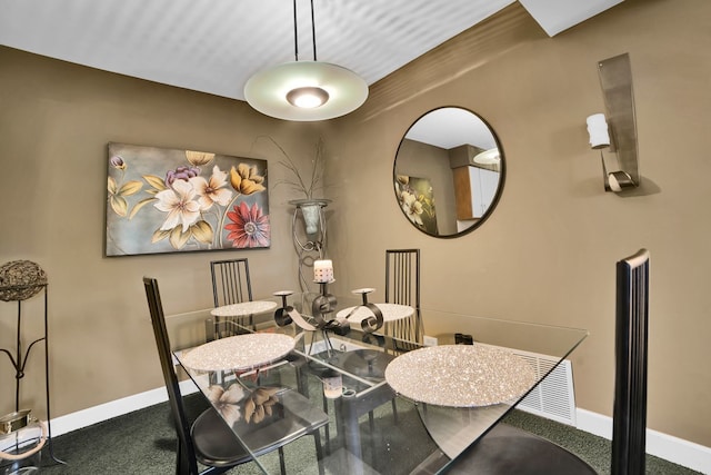 view of carpeted dining space