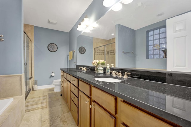 full bathroom with vanity, separate shower and tub, and toilet