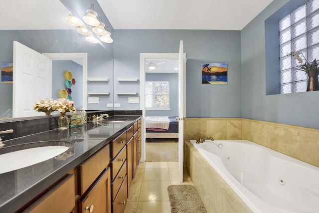 bathroom featuring tile patterned flooring, vanity, a relaxing tiled tub, and ceiling fan