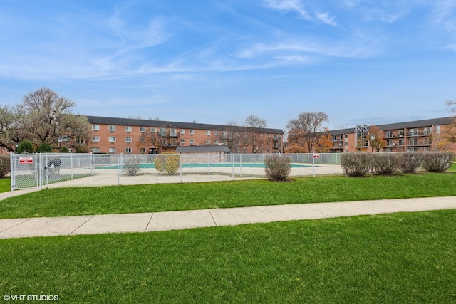 view of pool featuring a yard