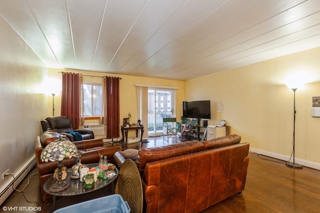 living room featuring baseboards, baseboard heating, and wood finished floors