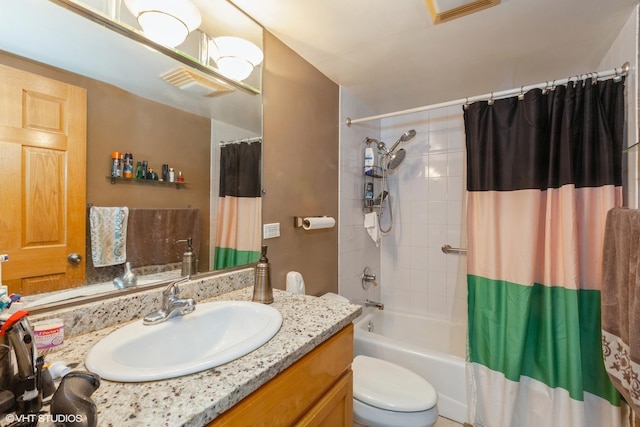 full bath with toilet, vanity, visible vents, and shower / tub combo with curtain