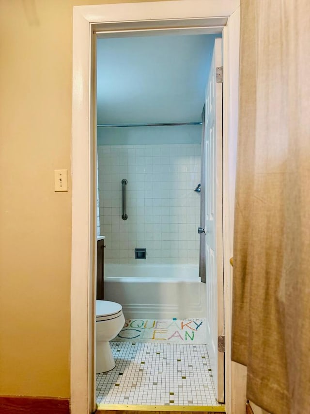 bathroom featuring toilet and tile patterned floors