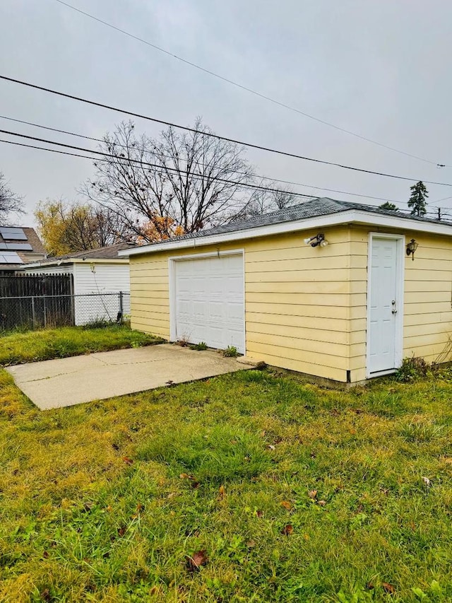 garage with a lawn