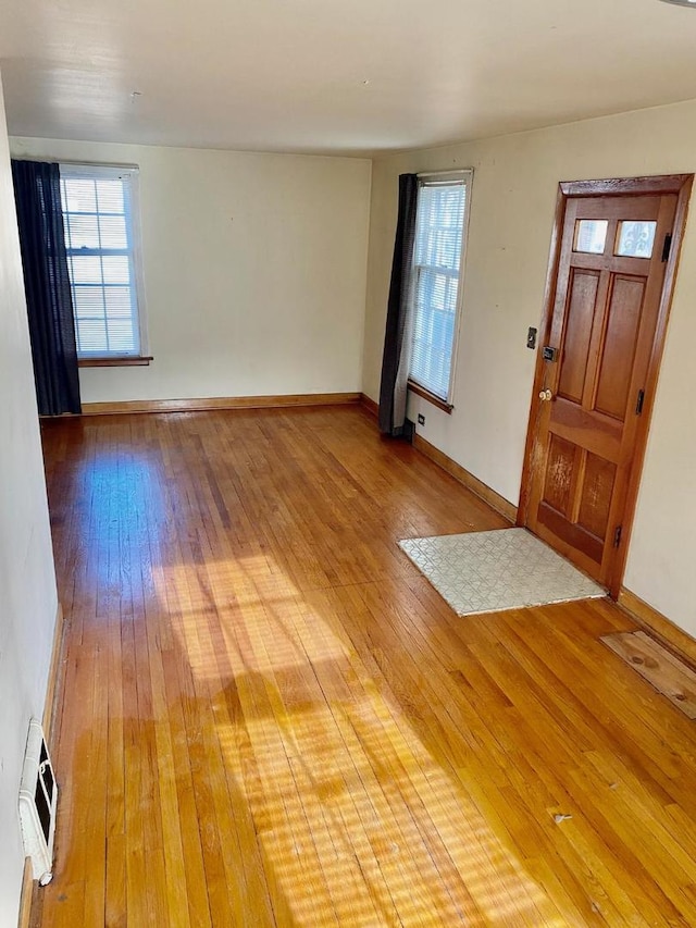 foyer entrance with hardwood / wood-style flooring