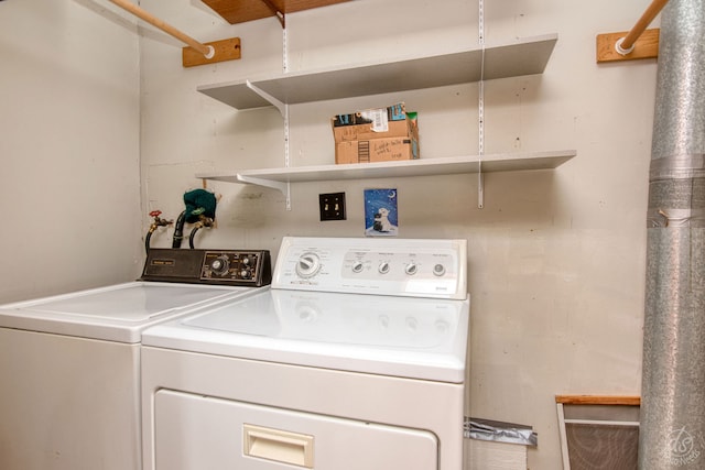 clothes washing area with washer and dryer