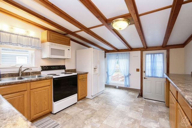 kitchen with beam ceiling, sink, and white appliances