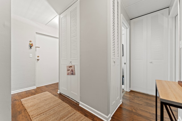 corridor with dark wood-type flooring