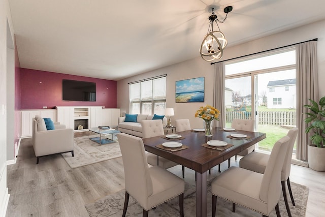 dining area featuring a chandelier and light hardwood / wood-style flooring