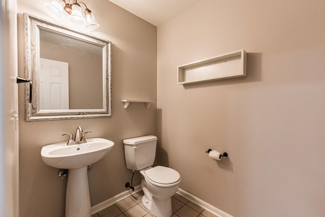 bathroom with tile patterned flooring and toilet