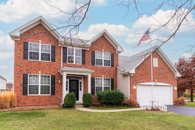 view of front of property with a garage and a front yard