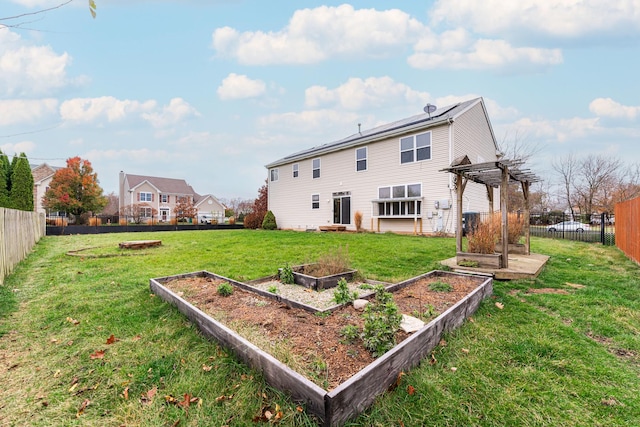 rear view of property featuring a lawn and a pergola