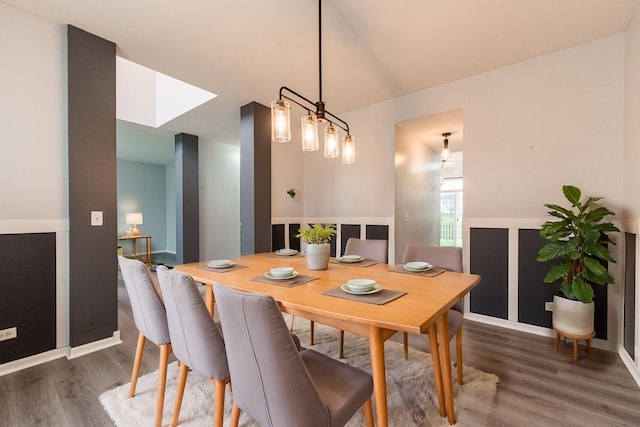 dining space featuring dark wood-type flooring