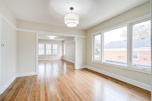 unfurnished room with light hardwood / wood-style flooring