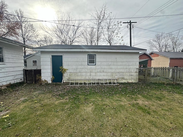 view of outbuilding featuring a yard