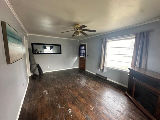 unfurnished room featuring ceiling fan, dark hardwood / wood-style flooring, and crown molding